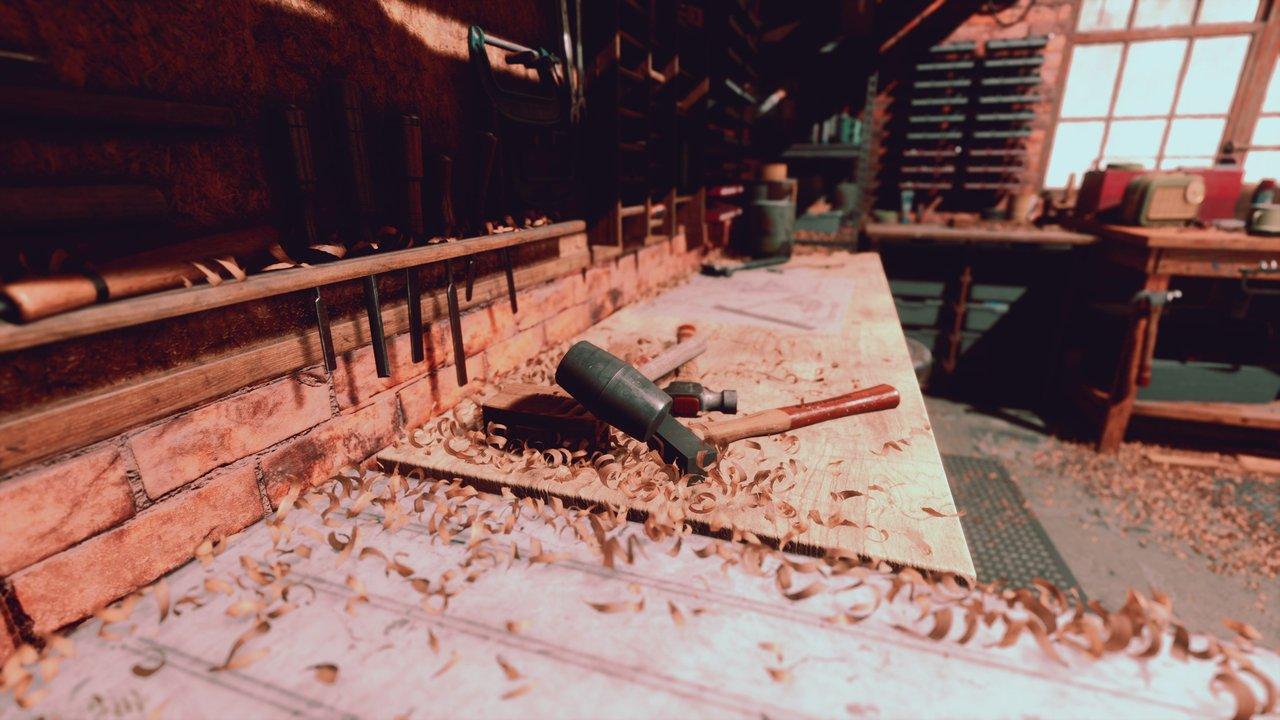 Un établi MFT avec plateau en MDF protégé par un martyr en bois massif dans un atelier de menuiserie traditionnel.